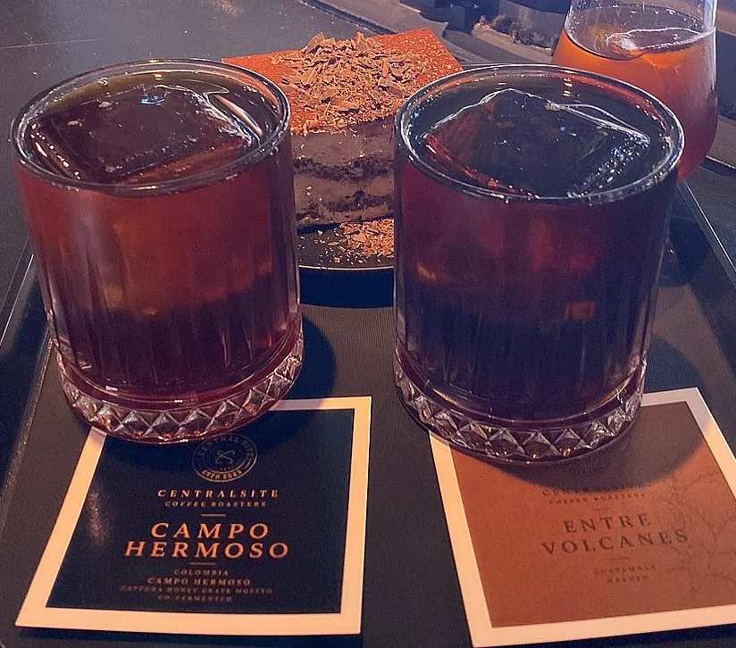 Iced brewing coffee served with tasting note cards