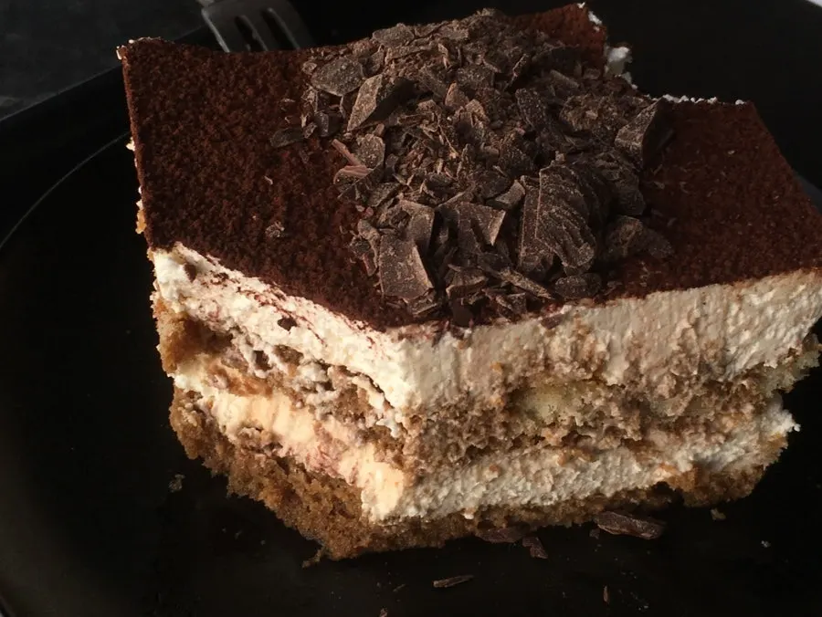 Tiramisu topped with soft cream