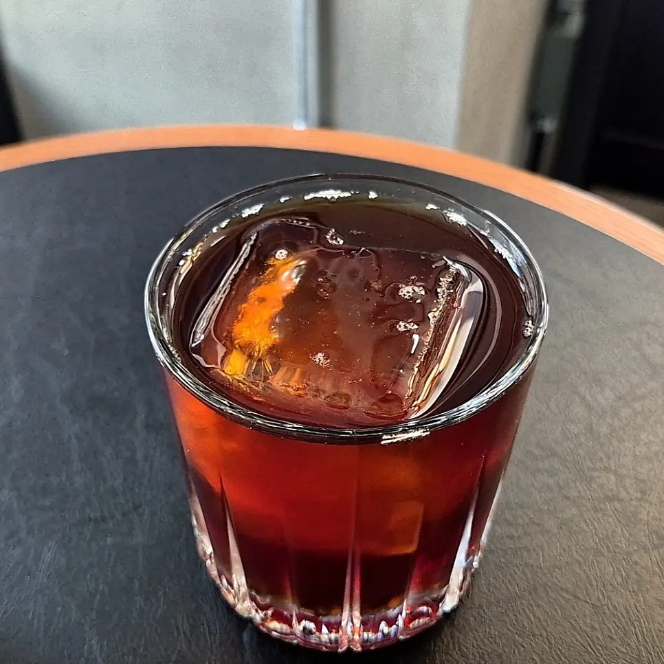 Specialty iced brewed coffee with a whole ice ball