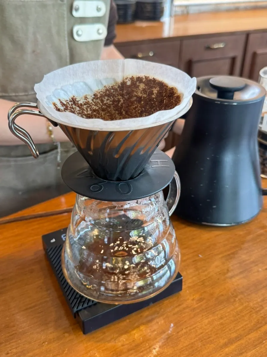 Checking the aroma of the freshly brewed drip coffee