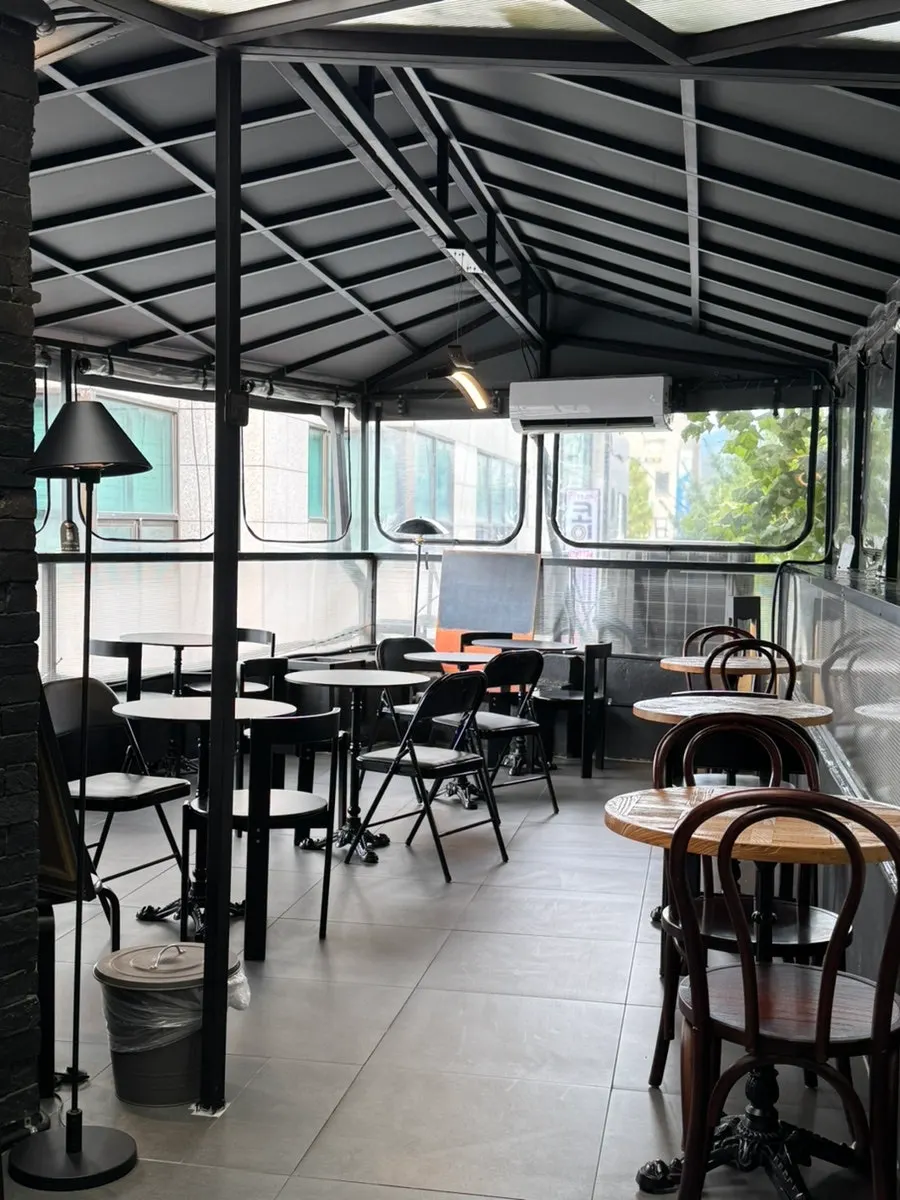 2nd-floor seat with a view of greenery outside the window