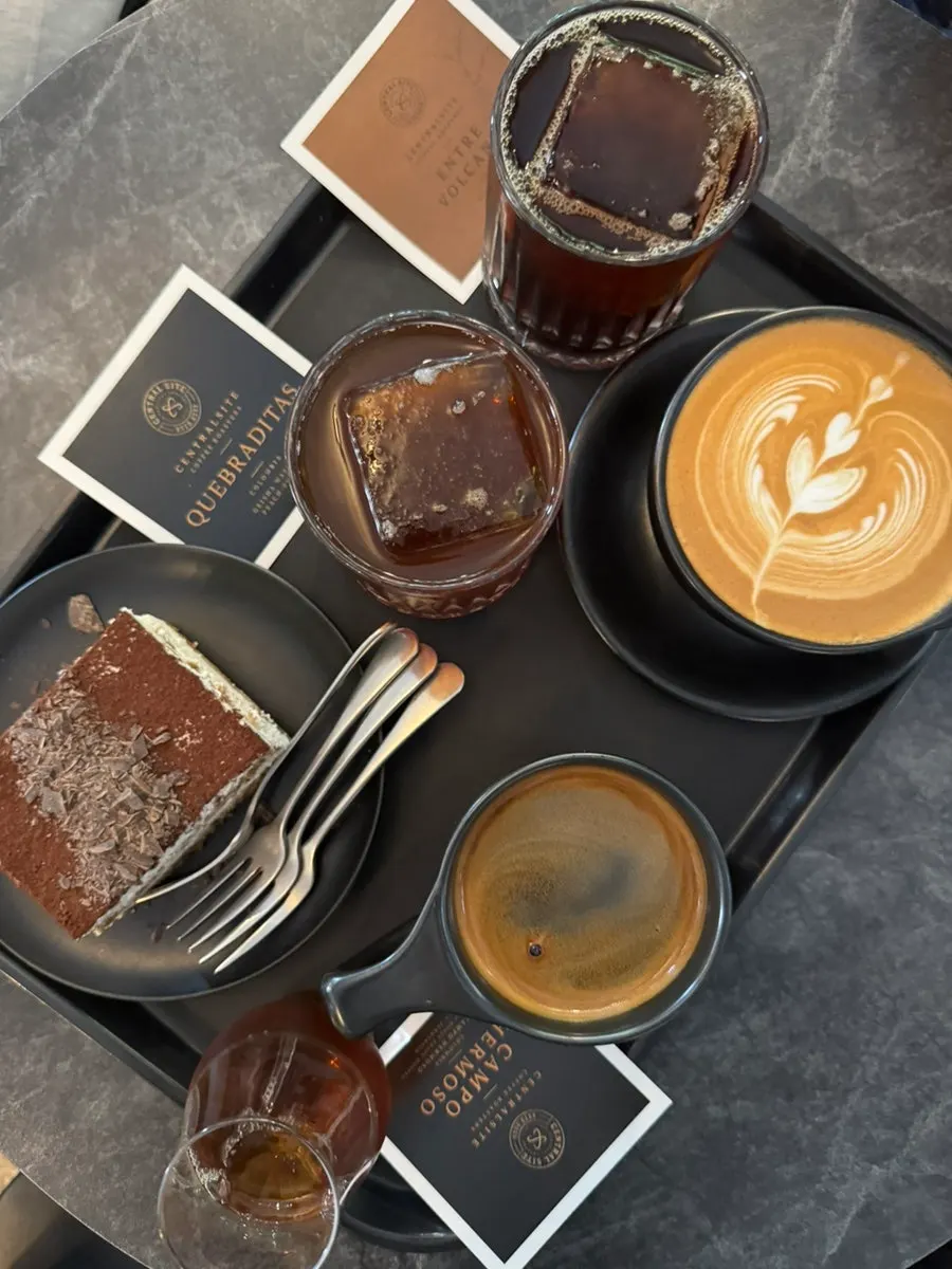 Two hand-drip coffees and other drinks on the table