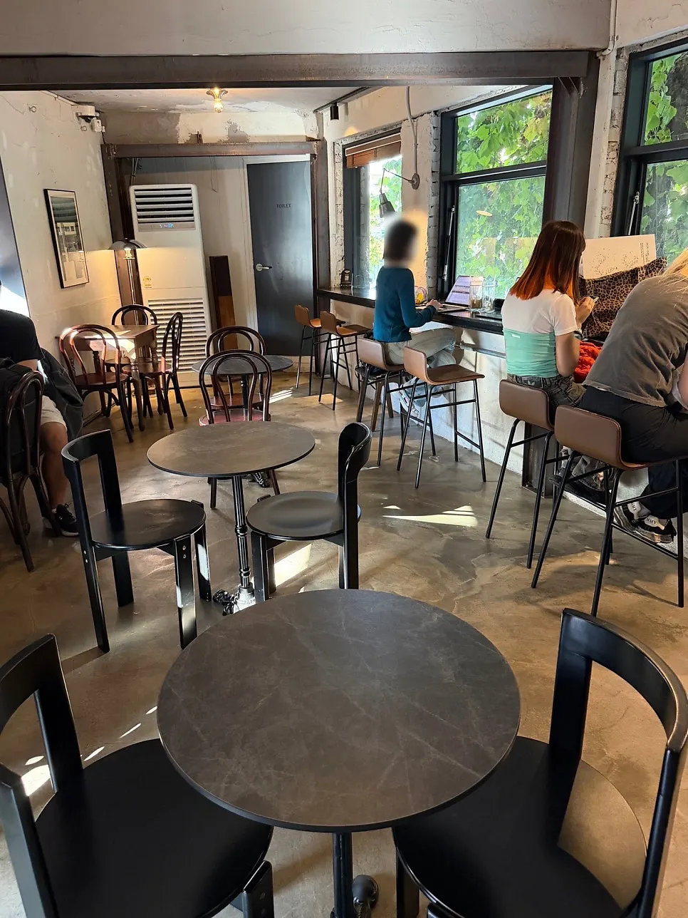 Neatly arranged second-floor seating at Central Site