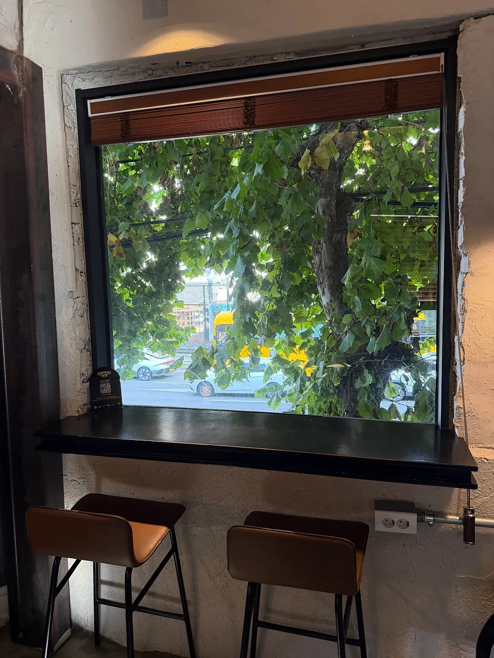 A second-floor seat with a window view
