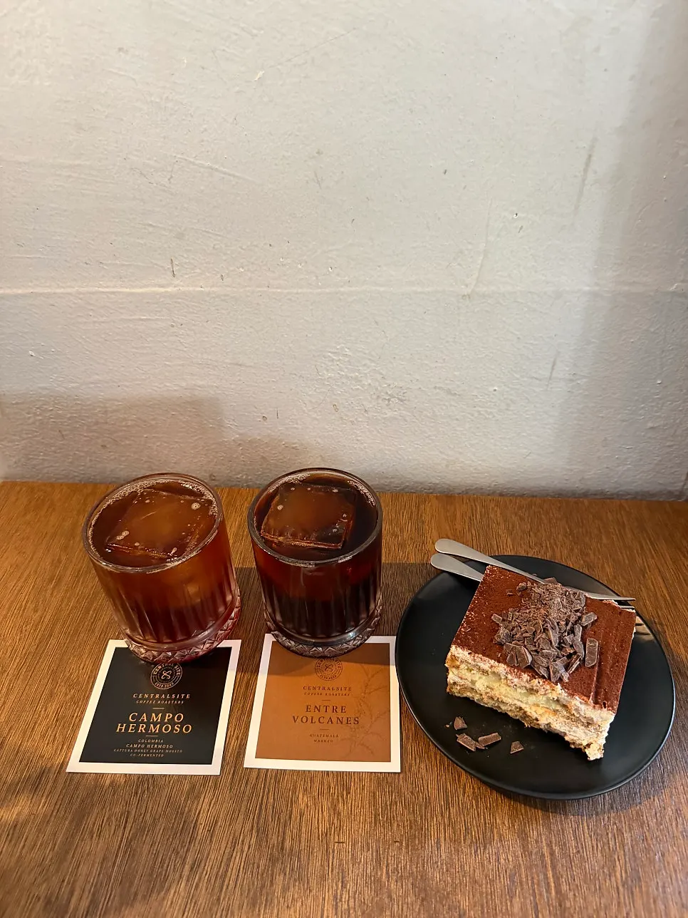 Brewed coffee and classic tiramisu set on a table