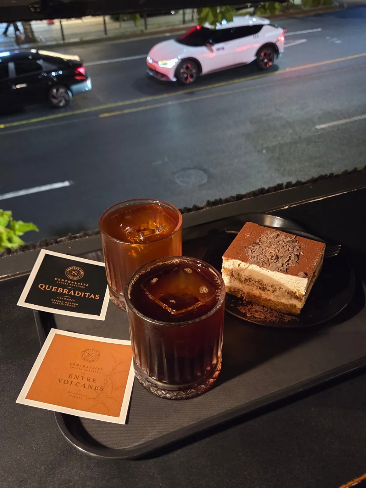 Coffee and dessert placed at a second-floor window seat