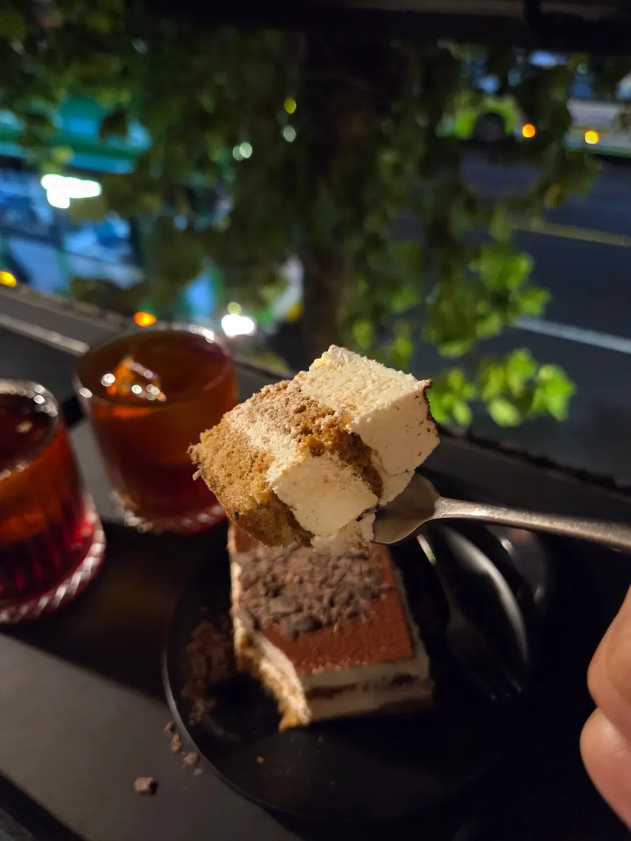 Cross-section of tiramisu showing cream and sponge layers
