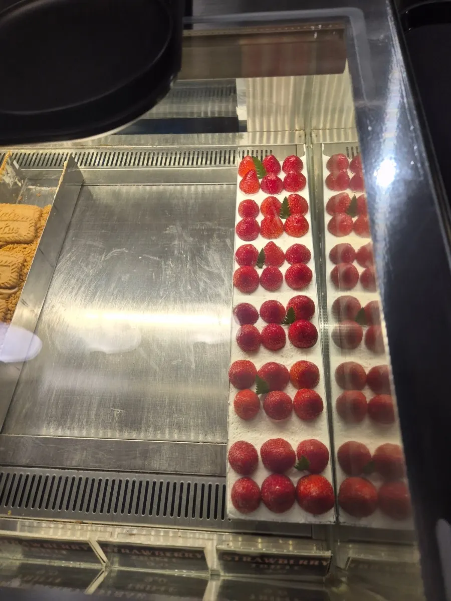 Cake and tiramisu inside the dessert showcase