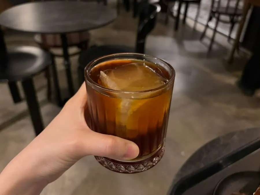 A cup of drip coffee with citrus and floral notes