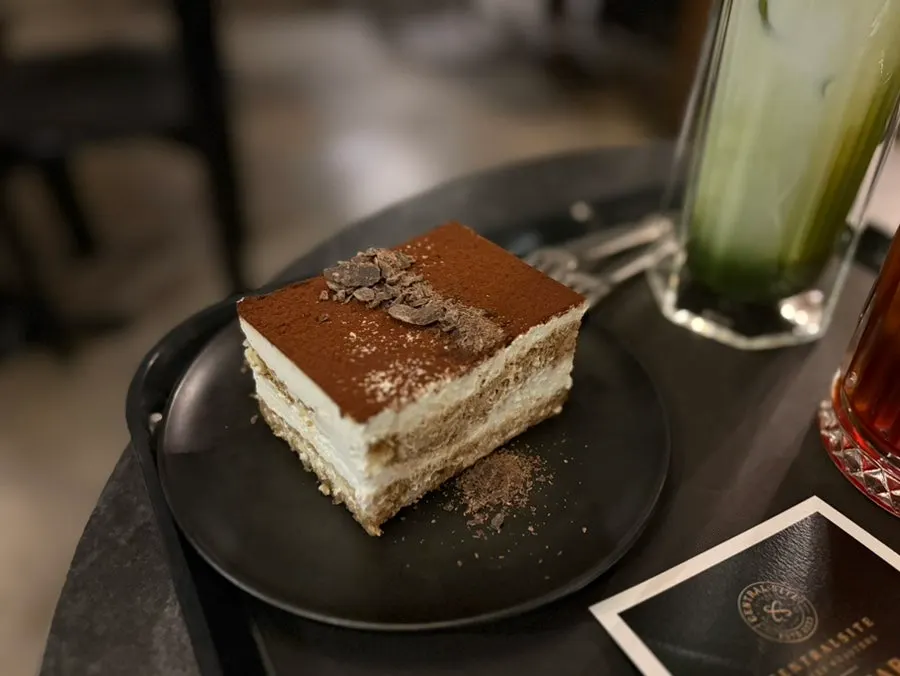 Classic tiramisu topped with cocoa powder and chocolate shavings