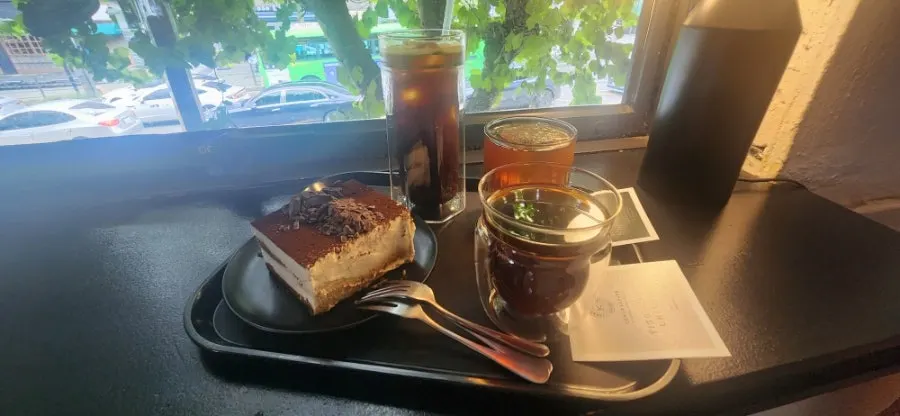 Three cups of drip coffee by the window