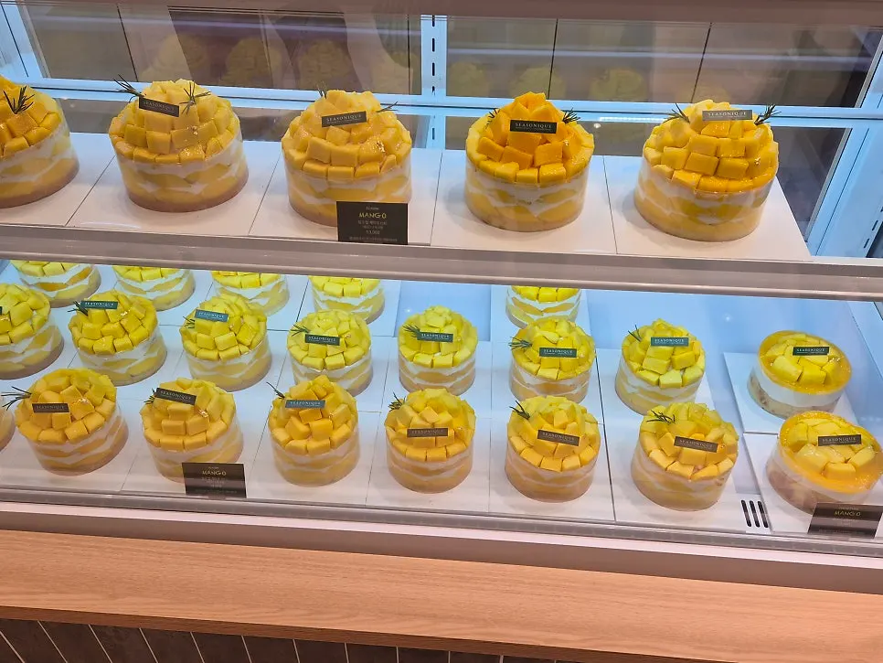Seasonal fruit cake varieties in the display case