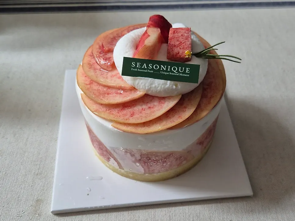 Full view of the unboxed mini peach cake