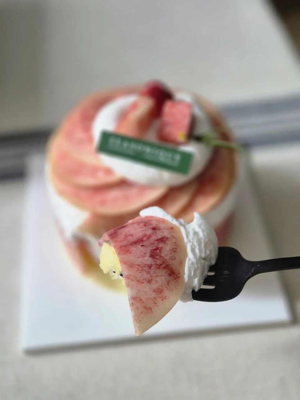 A slice of peach cake plated