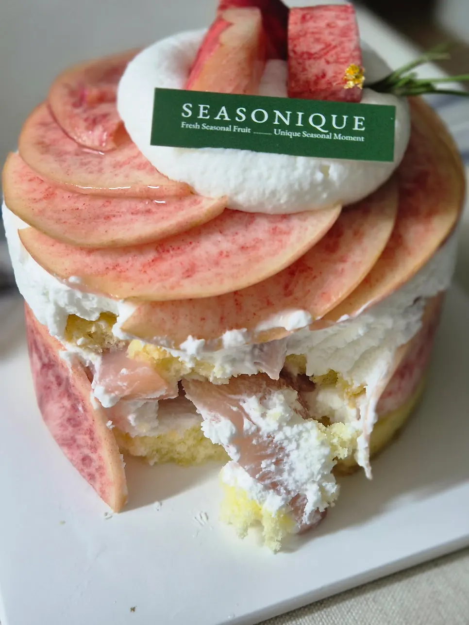 A forkful of peach cake showing the interior