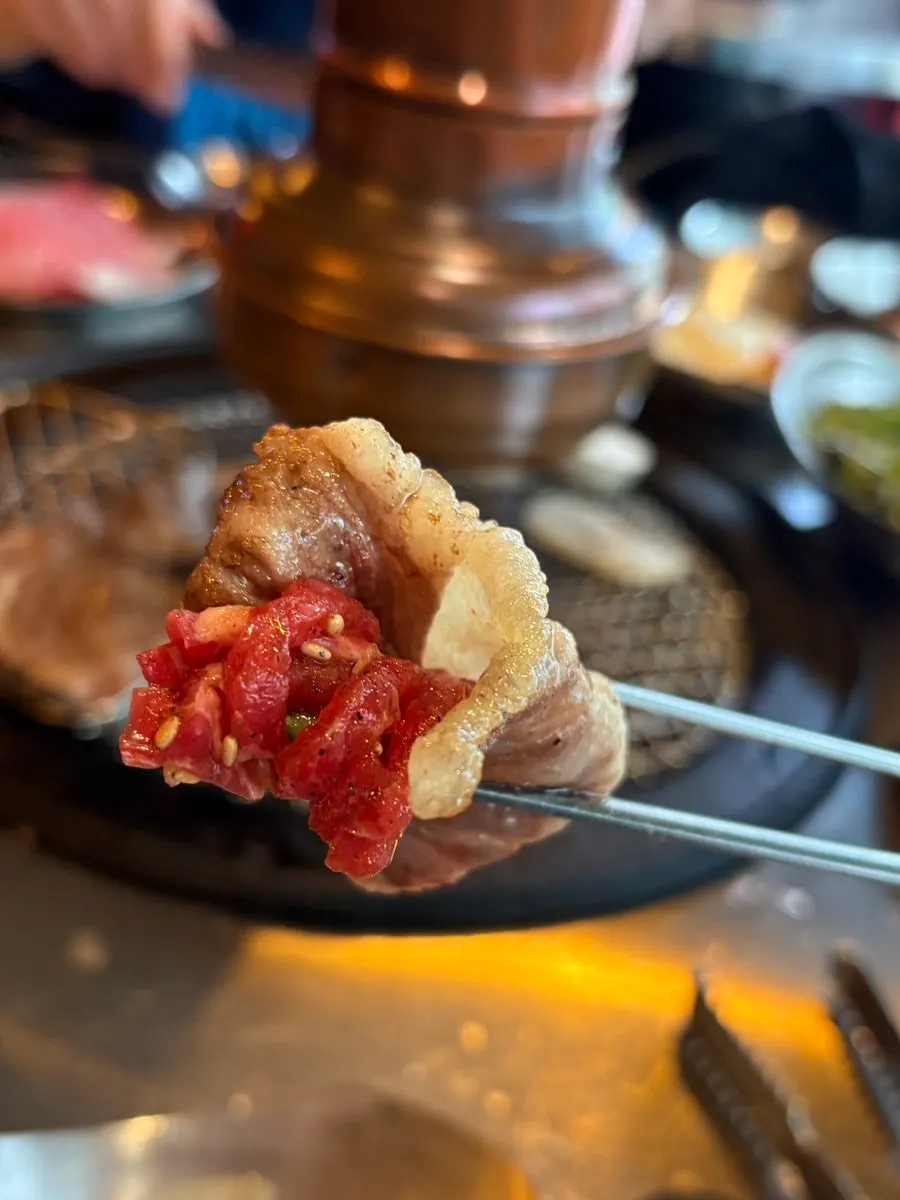 Grill with scallops and brisket cooking together