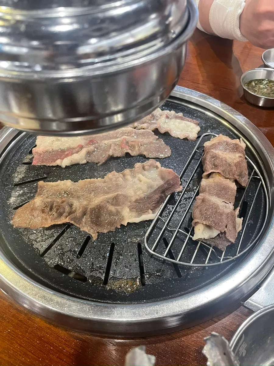 A golden-grilled piece of woo samgyeop