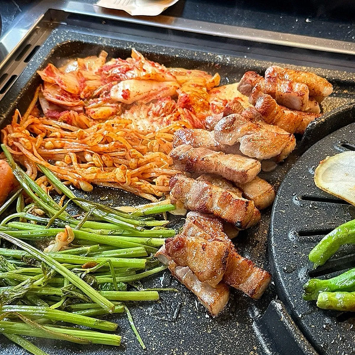 Pork belly cut and set in the lower part of the pan, ready to eat