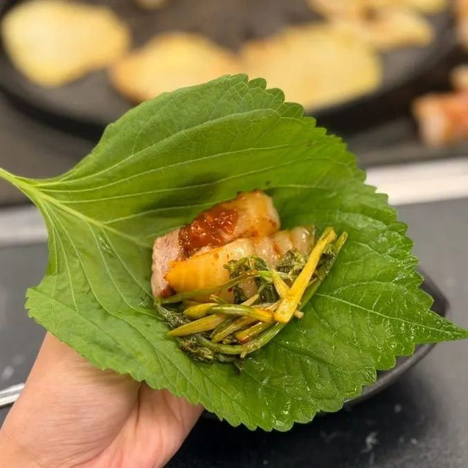 Wrap with shiitake wasabi and garlic scapes