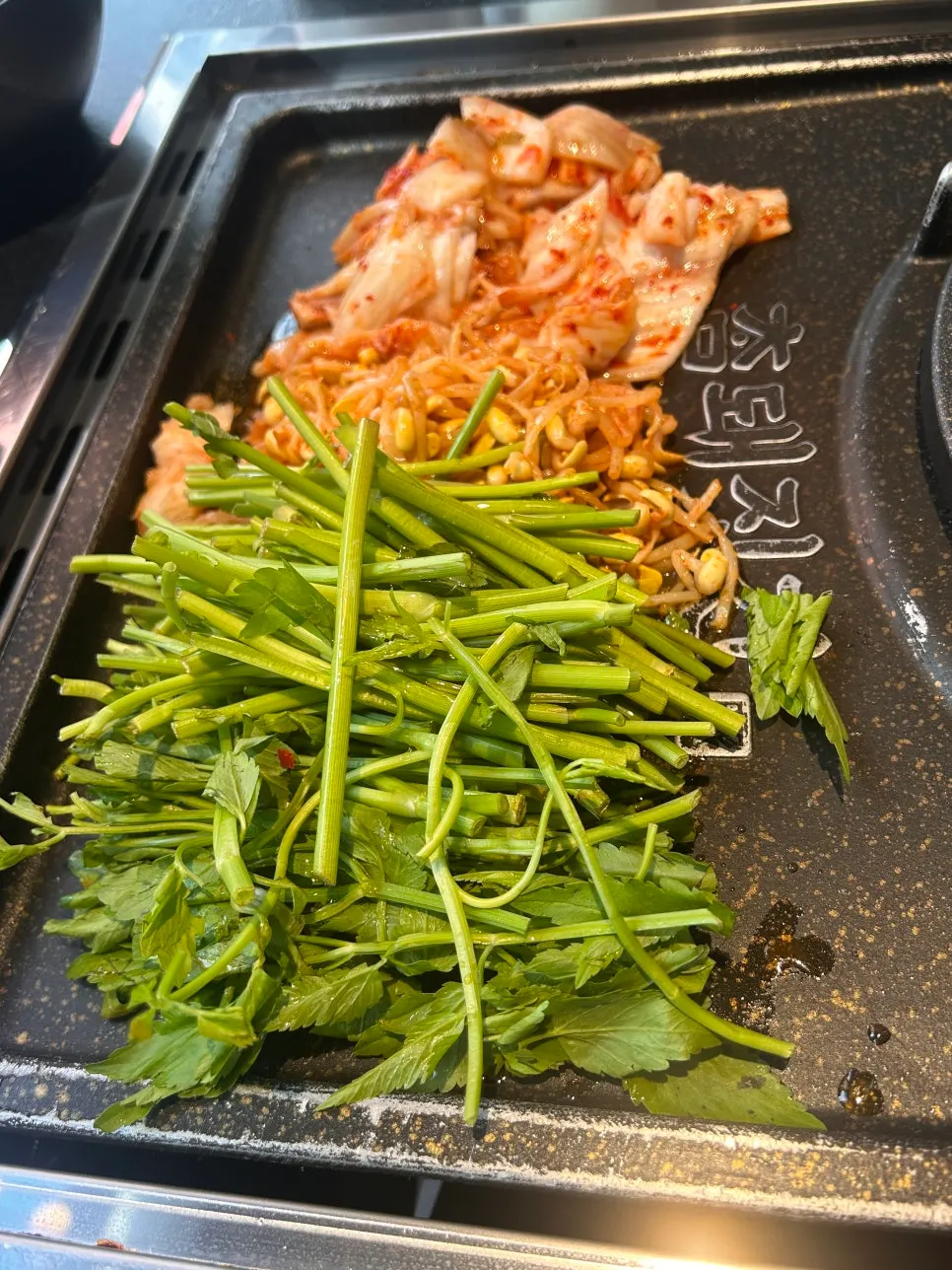 Smoky aroma rising from the pork belly on the grill