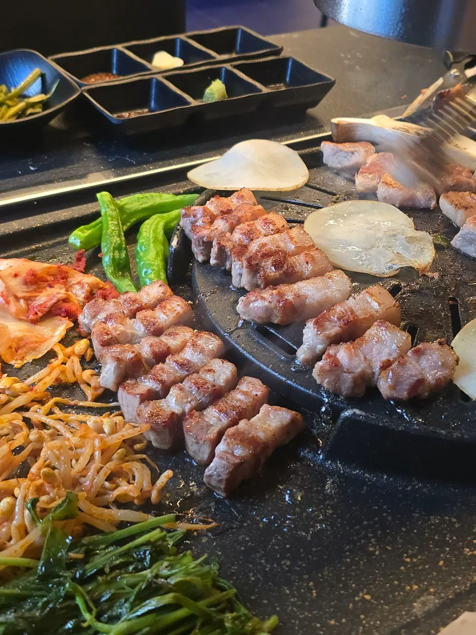 Pork belly cooking on the handmade grill pan