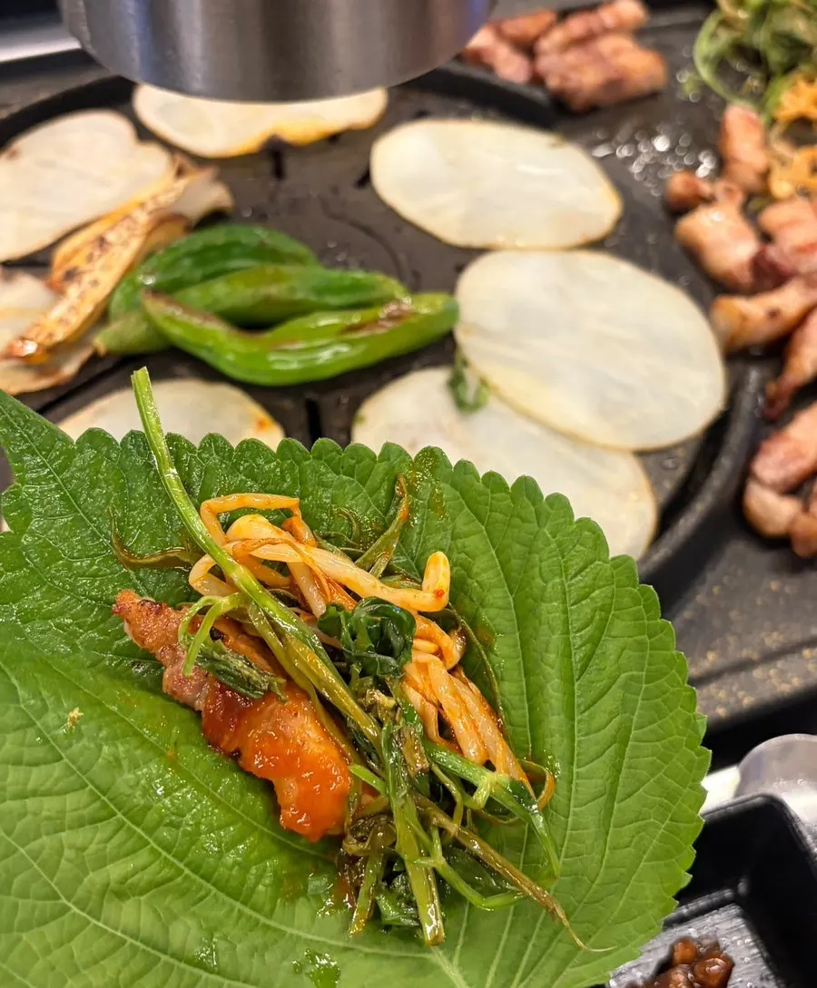 Cham Dwaejitgan pork belly wrapped in perilla leaf