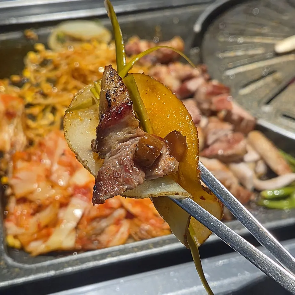 Table spread of grilled meat at Cham Dwaejitgan Bucheon Sinjung-dong Branch
