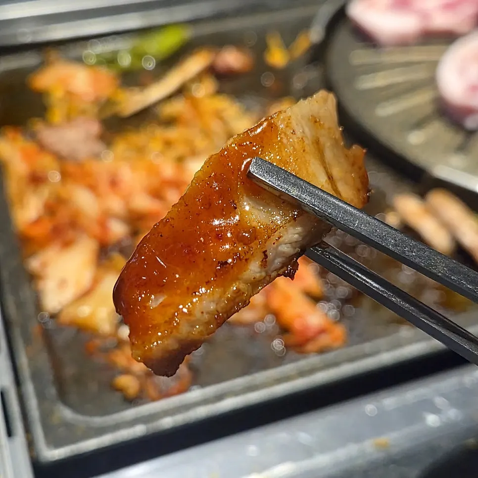 Pork belly wrapped with grilled sliced potato