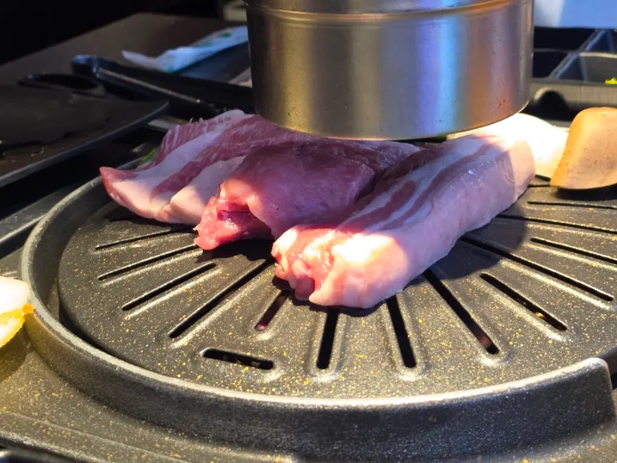 Meat, minari, and kimchi on the handmade grill pan