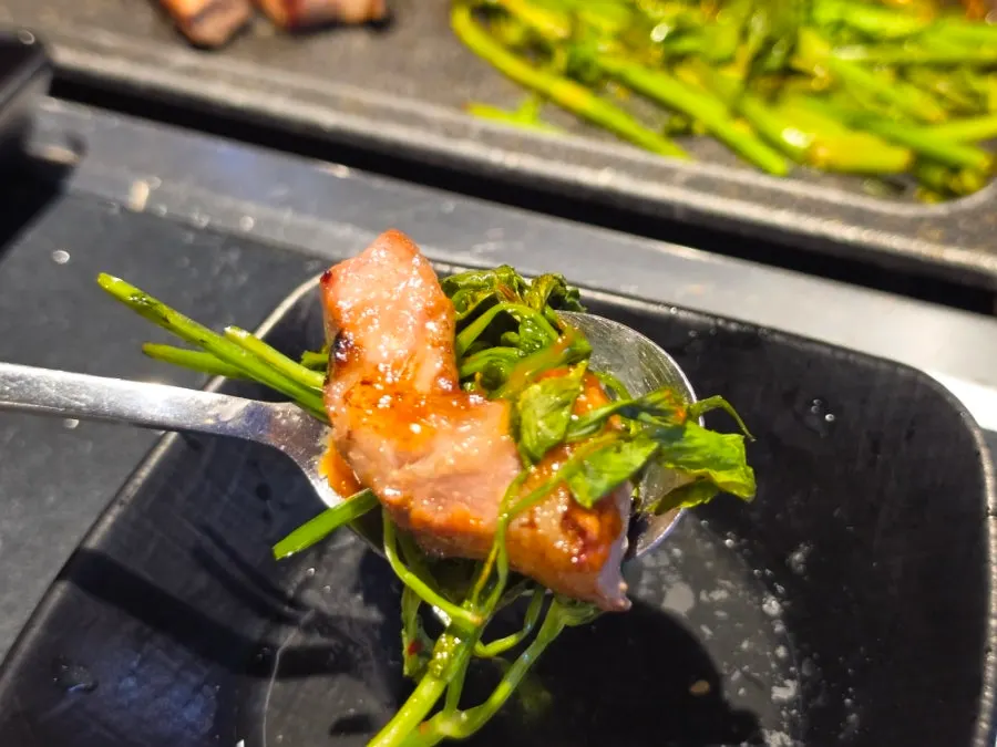 A piece of meat topped with wasabi