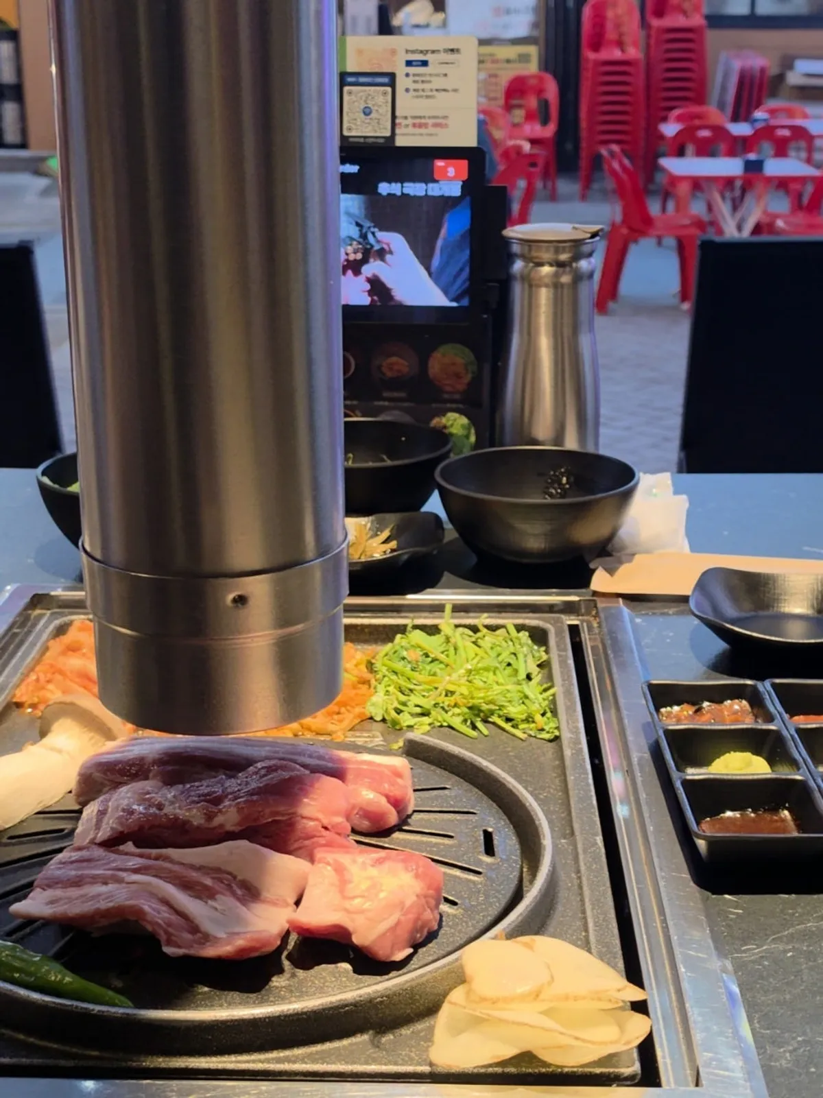 Vertical photo of the meat spread at Cham Dwaejitgan Bucheon Sinjung-dong Branch