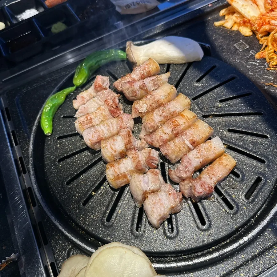 Grilled shishito peppers, mushrooms, and sliced potato sides