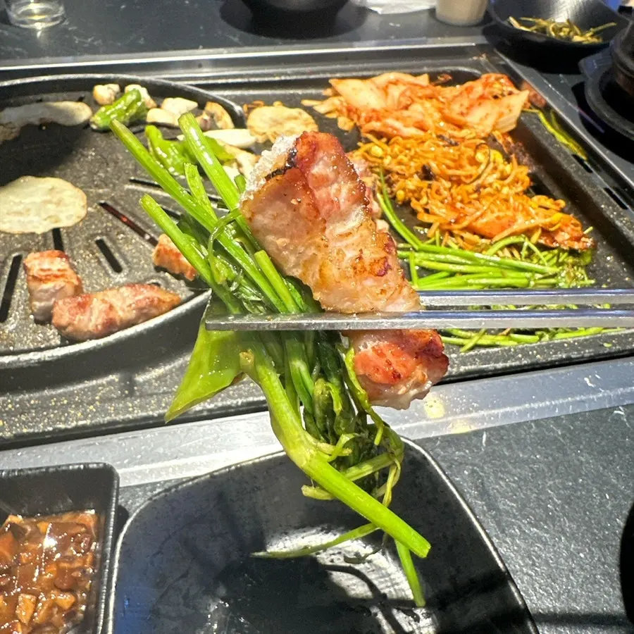 Pork belly picked up together with minari