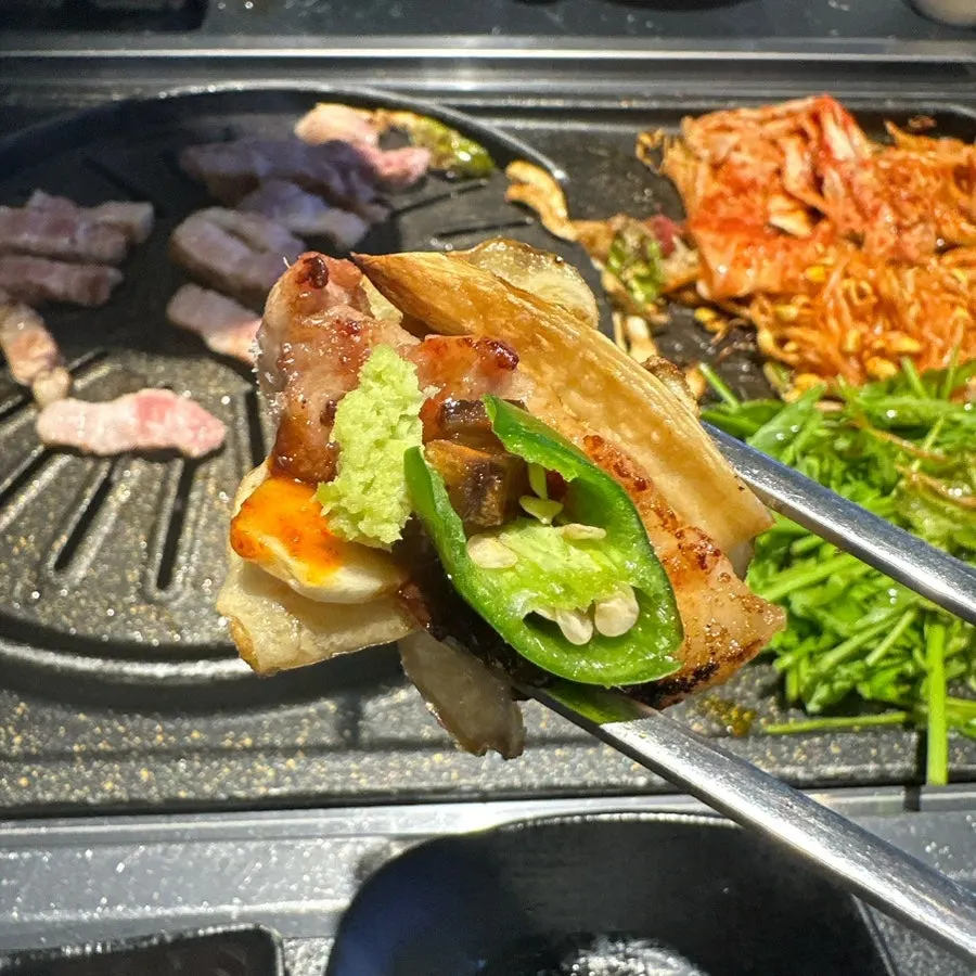 Potato and meat cooking on the grill