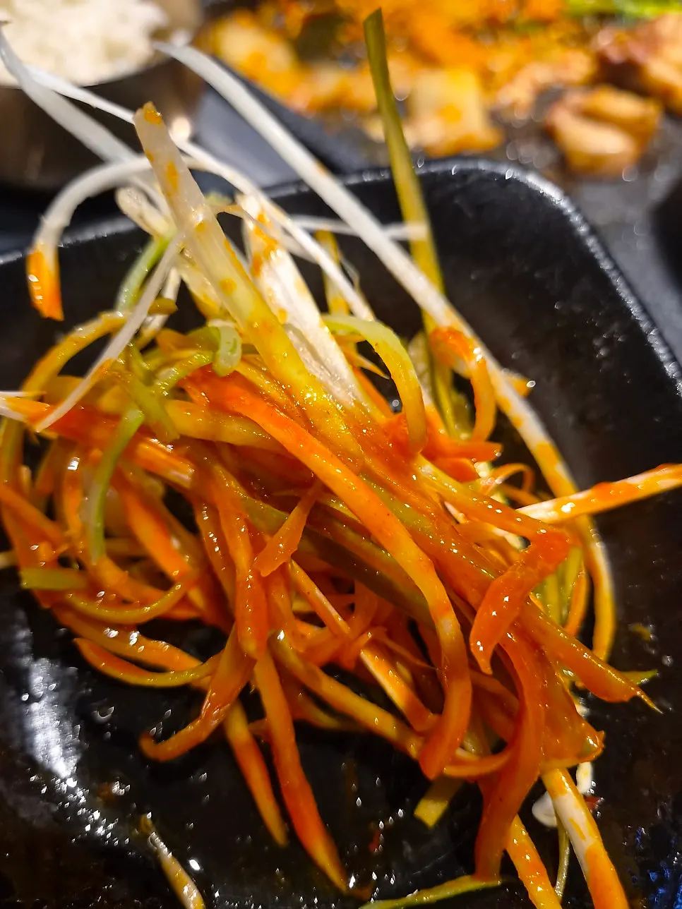 Close-up of the spicy and tangy scallion salad