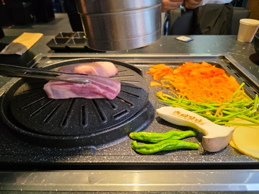 Jeju black pork belly placed on the grill