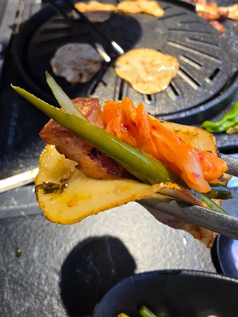 Fully cooked black pork with grilled kimchi
