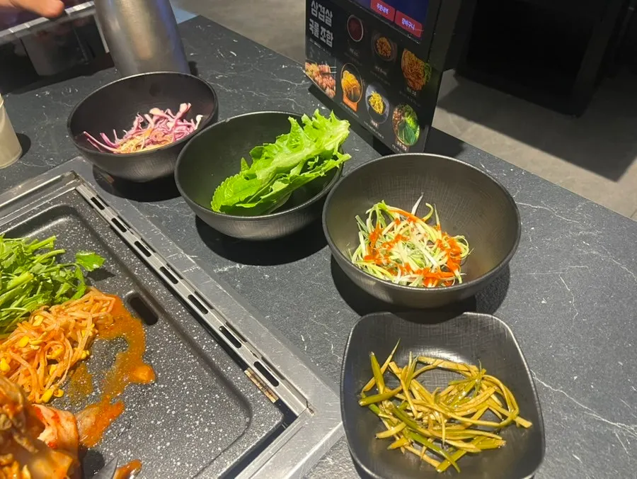 Ssam greens, scallion salad and salad side dishes