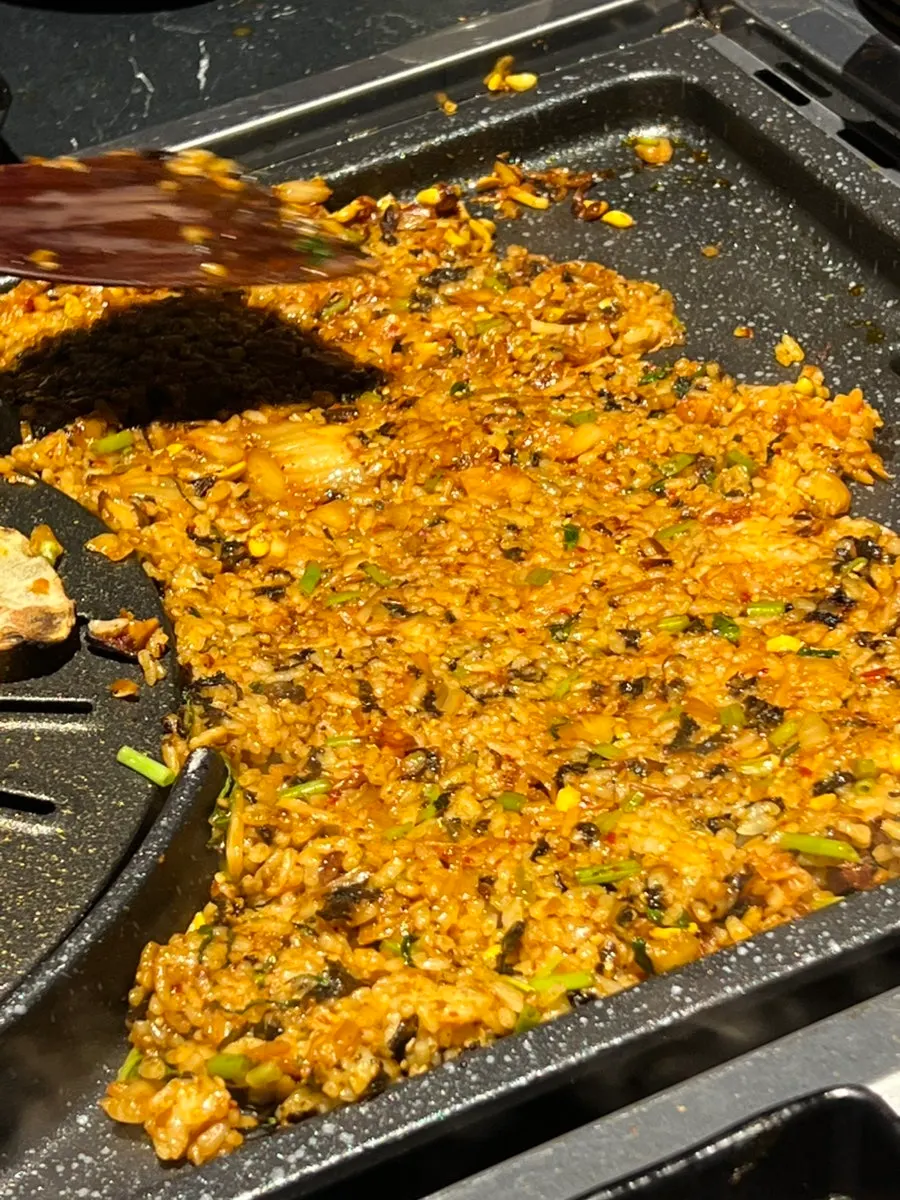 Kimchi fried rice crisping on the grill plate