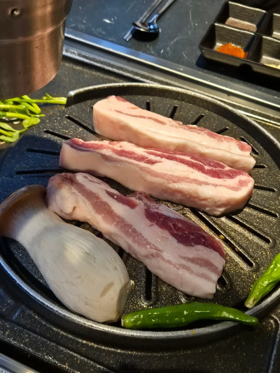 Three servings of raw Boseong nokdon pork belly at Cham Dwaejitgan