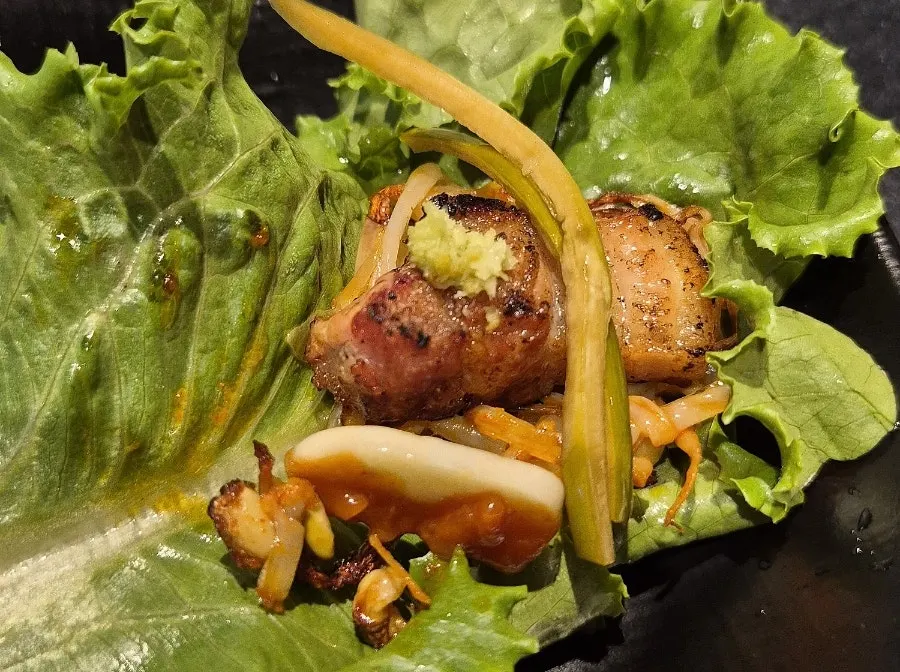 Pork belly dipped in an assortment of sauces