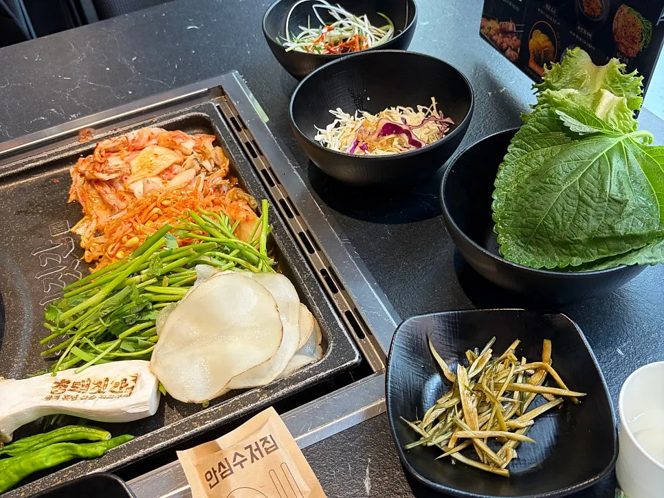 Meat and basic side dishes set out on the table