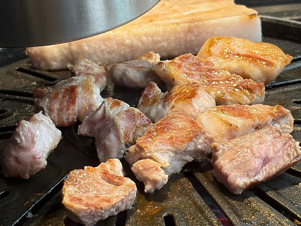 Flower pork neck cooking on the grill