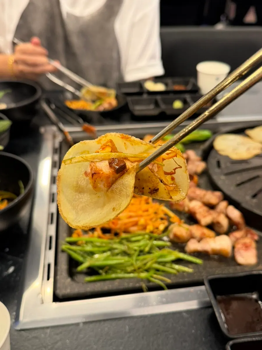 Pork belly wrapped with potato slices