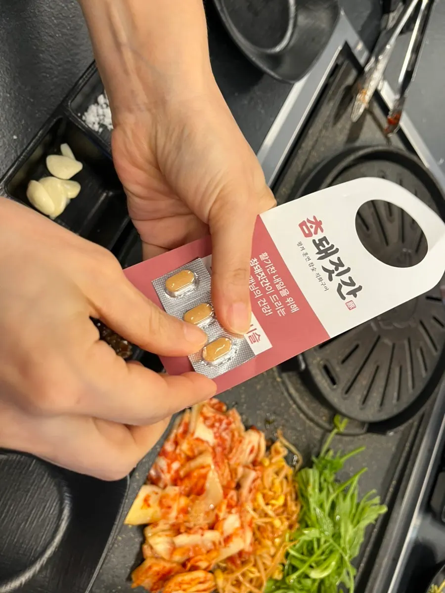Meat cooking on the grill plate