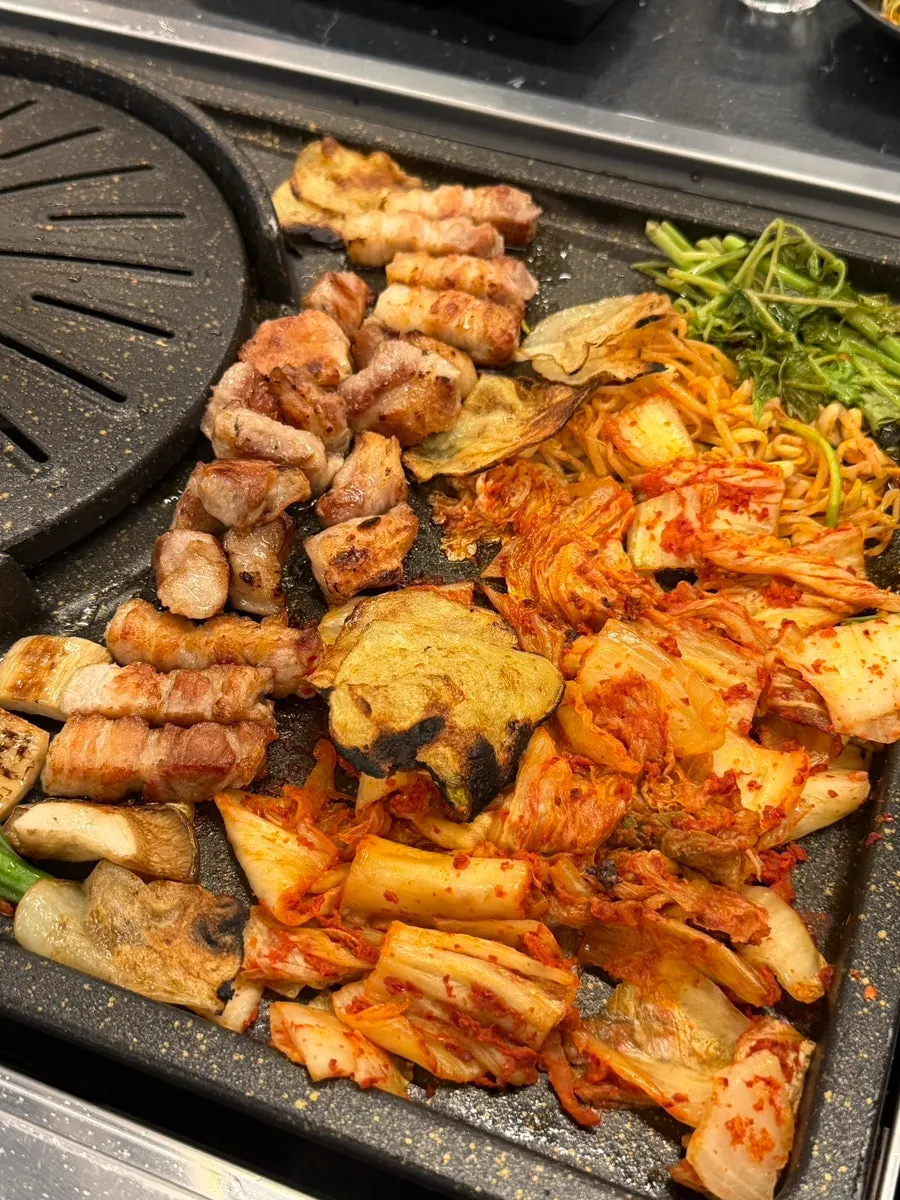 Generous portion of minari on the lower part of the grill