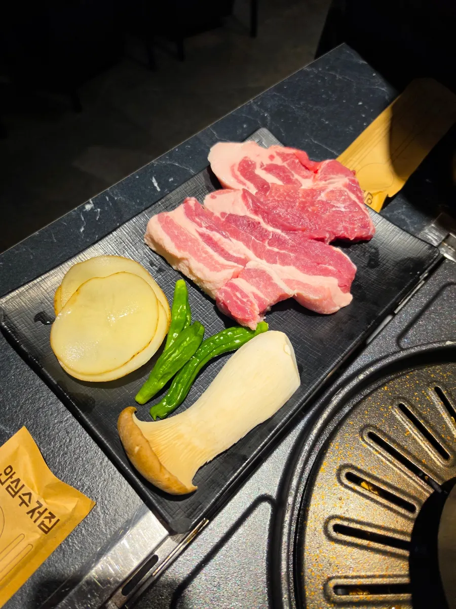 Kimchi and minari laid on the grill first