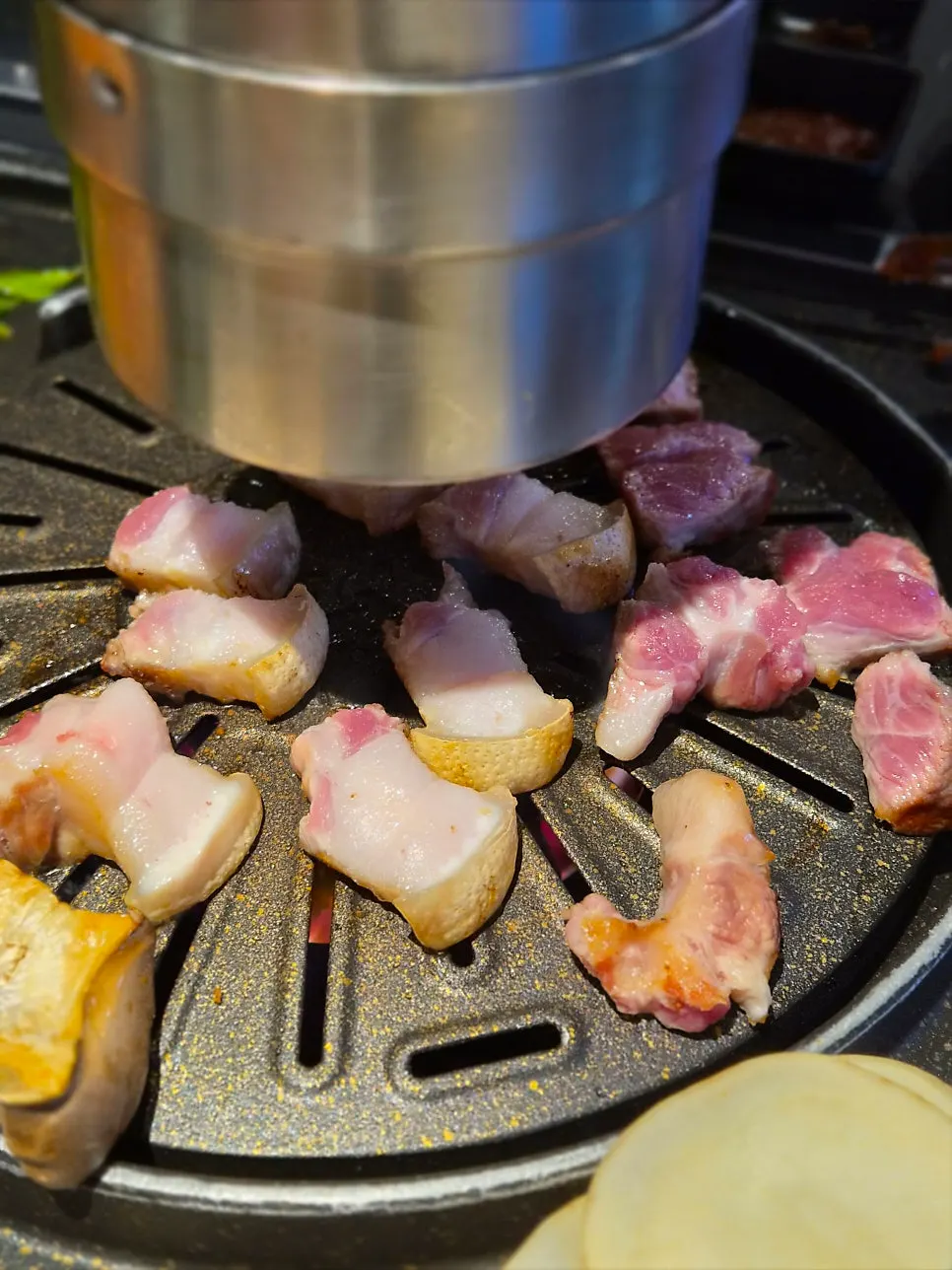 Staff grilling the pork belly