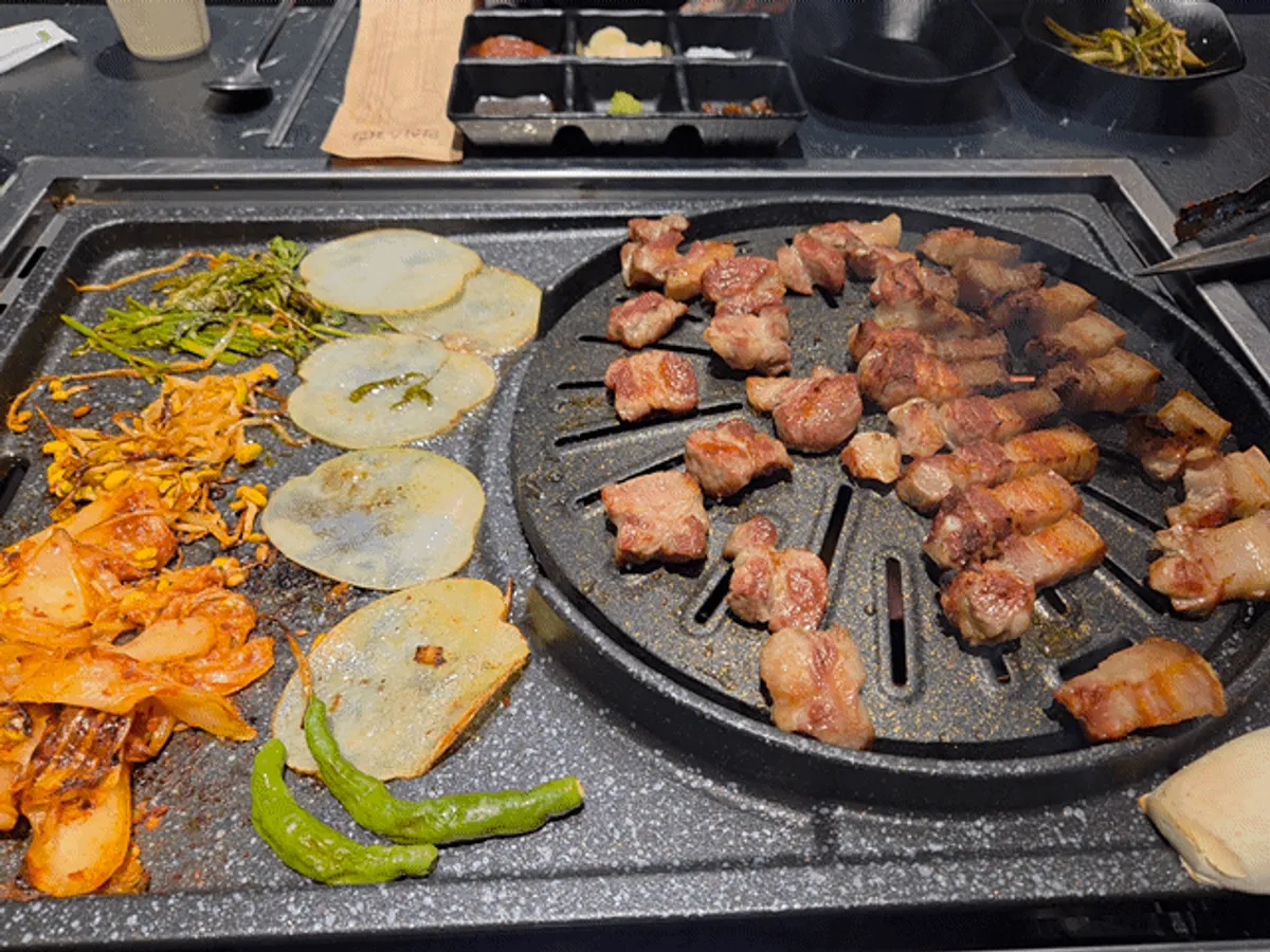 Black pork BBQ table setting at Cham Dwaejitgan Bucheon Sinjung-dong Branch