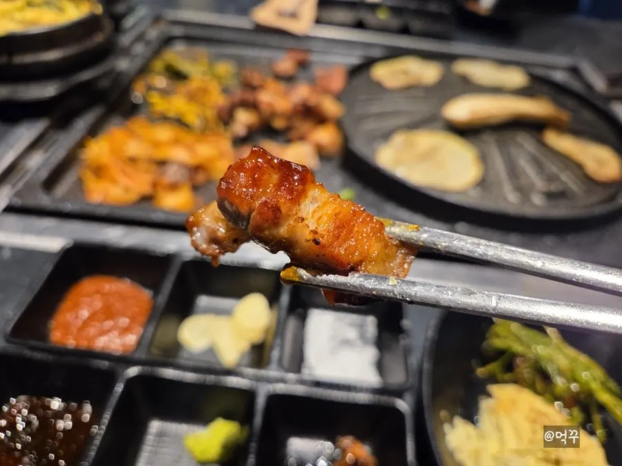 A piece of meat with salt and wasabi